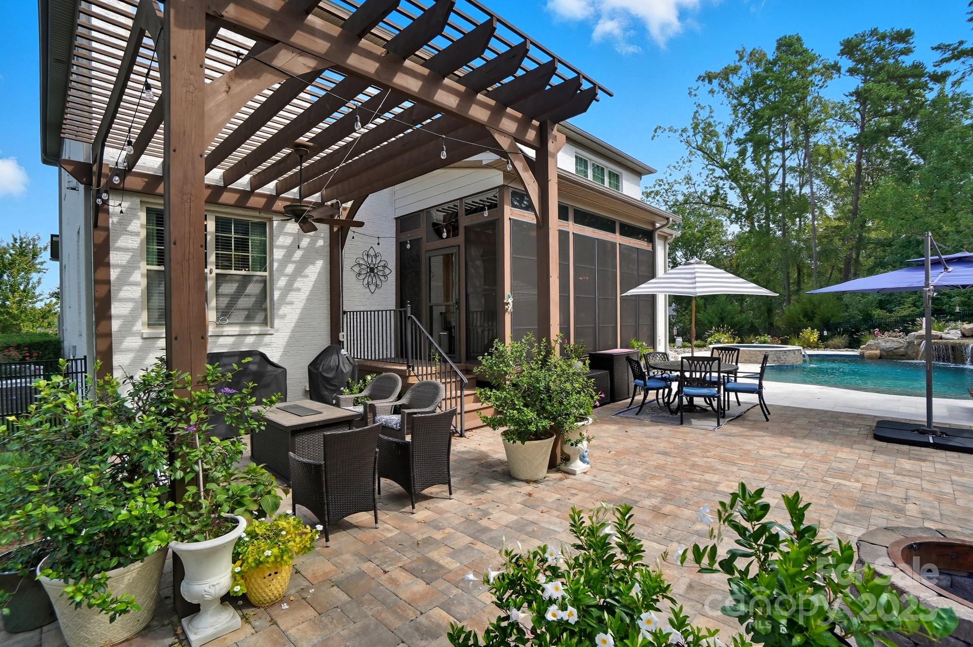 546 Abelia Lane Fort Mill, SC 29708 - Photo 34 of 43 a view of patio with chairs and potted plants