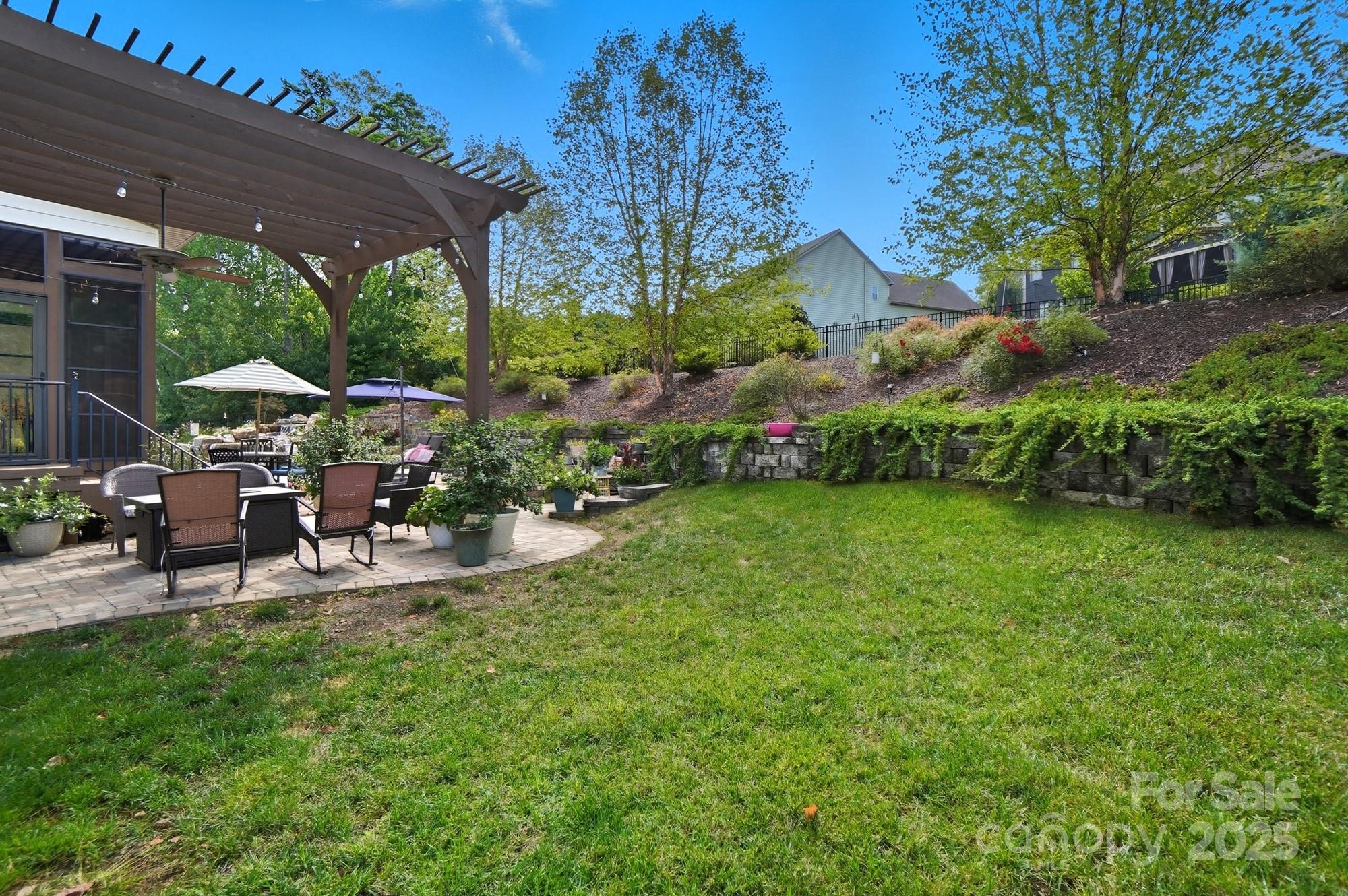 546 Abelia Lane Fort Mill, SC 29708 - Photo 35 of 43 a view of a house with backyard and sitting area