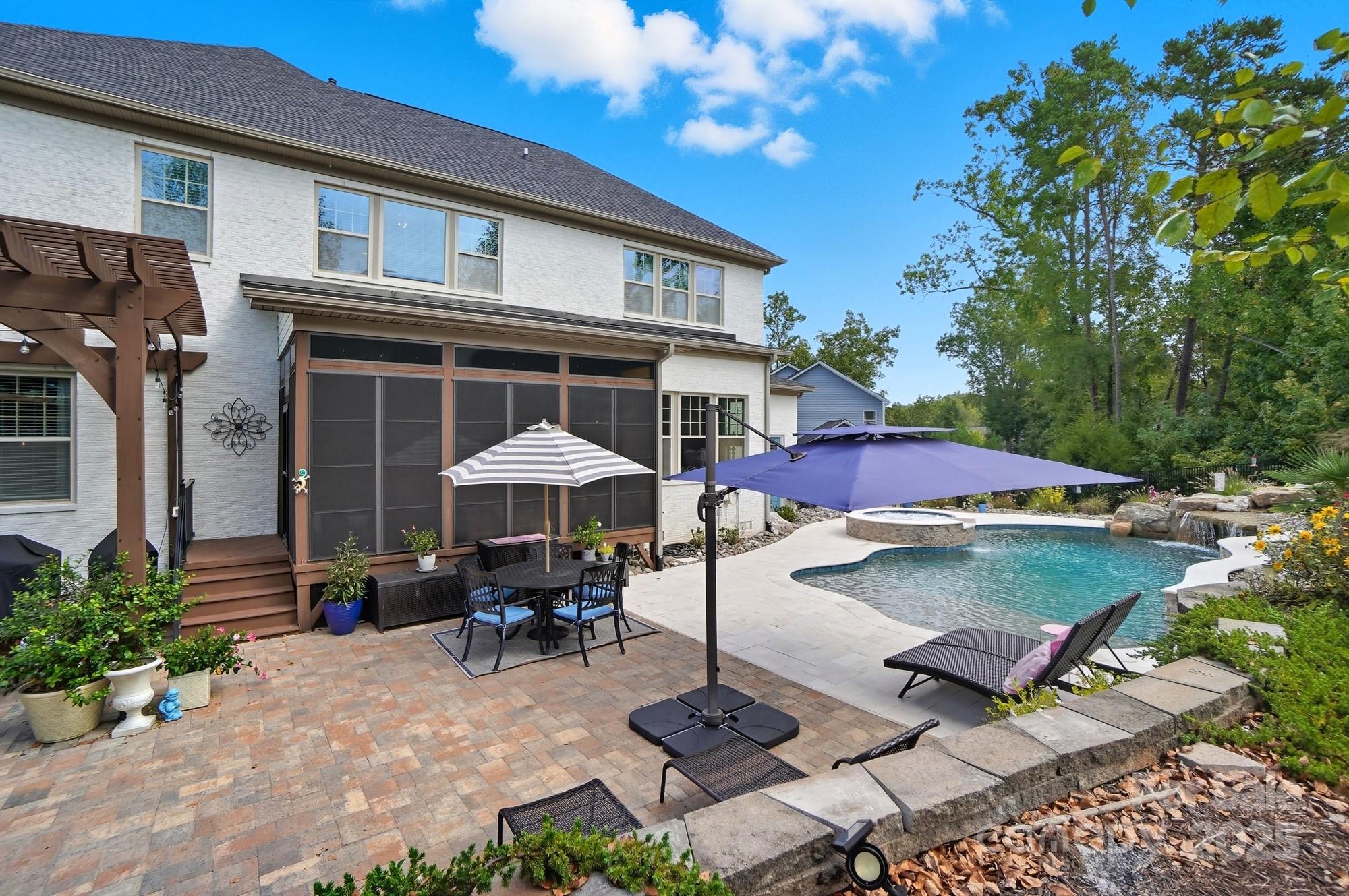 546 Abelia Lane Fort Mill, SC 29708 - Photo 39 of 43 a backyard of a house with barbeque oven table and chairs