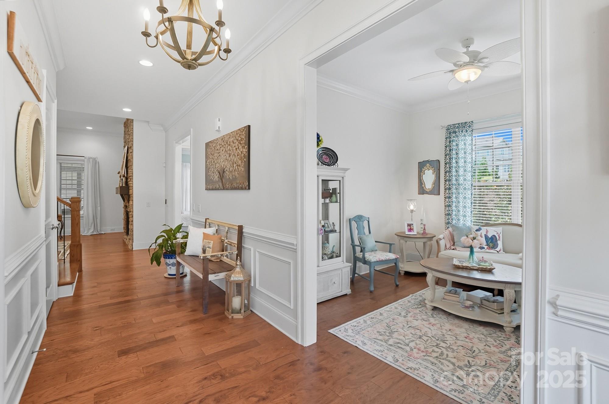 546 Abelia Lane Fort Mill, SC 29708 - Photo 6 of 43 a living room with furniture and a chandelier