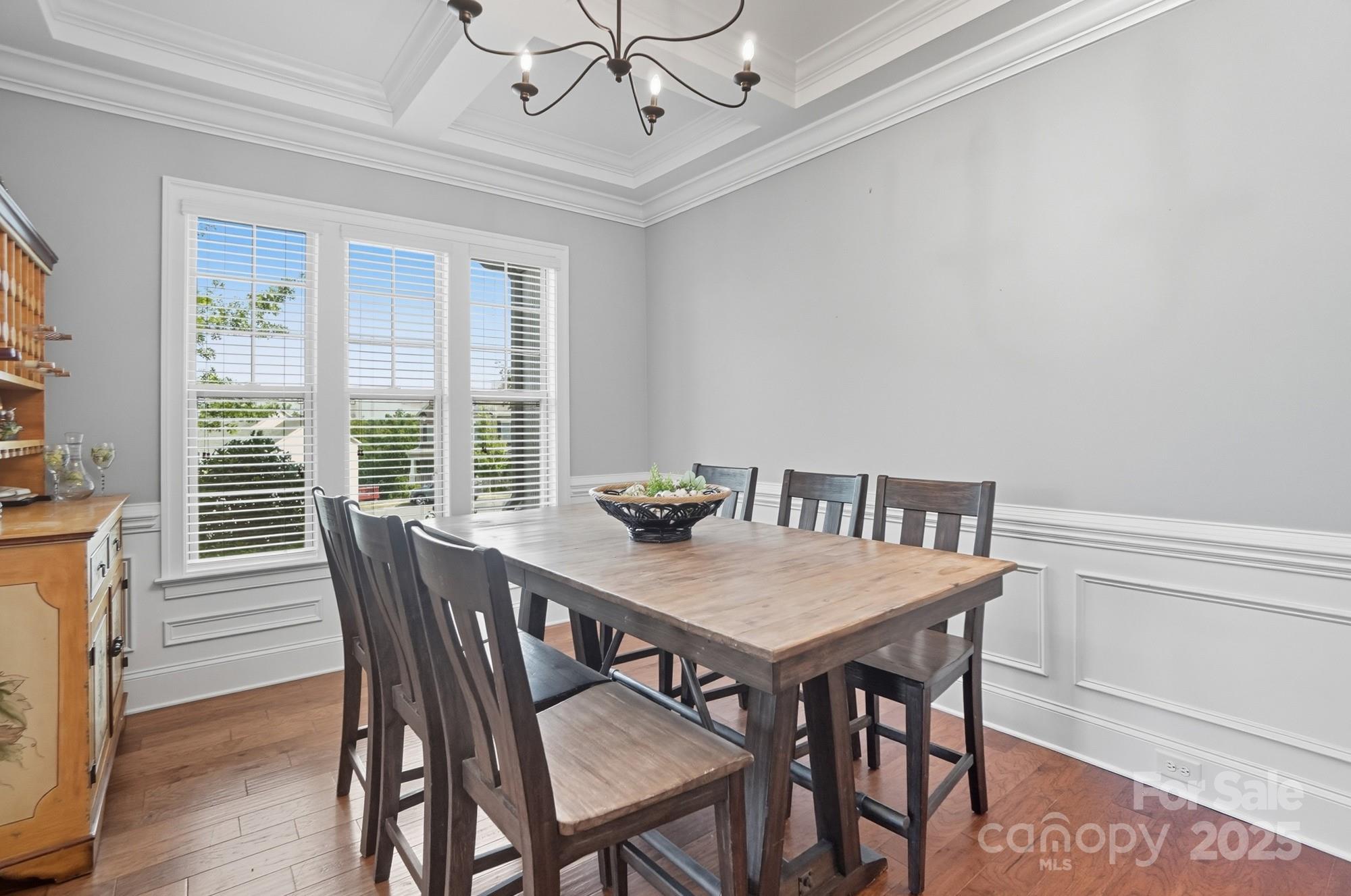 546 Abelia Lane Fort Mill, SC 29708 - Photo 9 of 43 a view of a dining room with furniture window and wooden floor