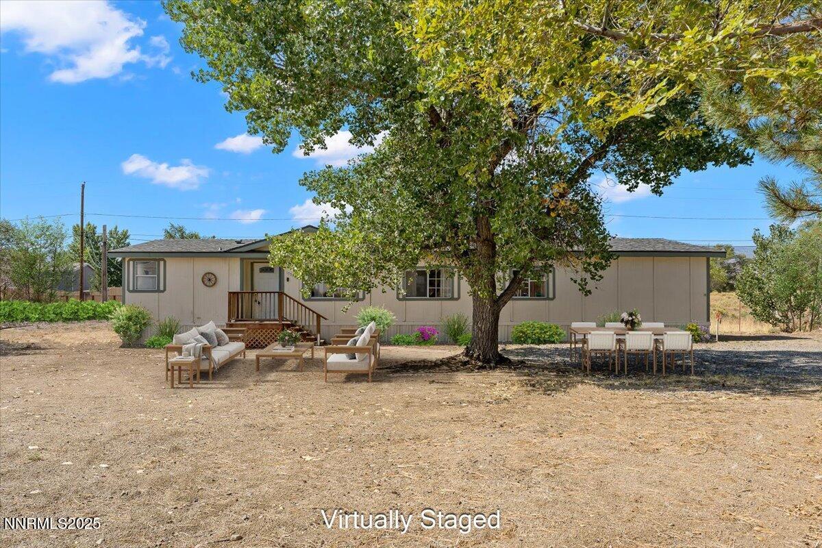 17570 Thrush Lane Reno, NV 89508 - Photo 1 of 30 a view of a house with backyard and sitting area