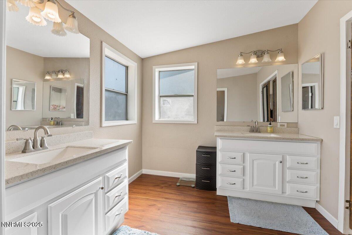 17570 Thrush Lane Reno, NV 89508 - Photo 17 of 30 a bathroom with a granite countertop sink mirror and cabinets