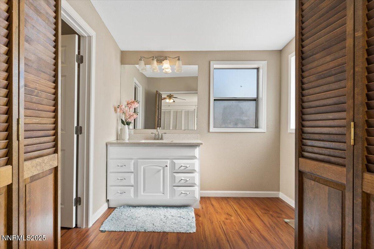 17570 Thrush Lane Reno, NV 89508 - Photo 18 of 30 a spacious bathroom with a granite countertop sink and a mirror
