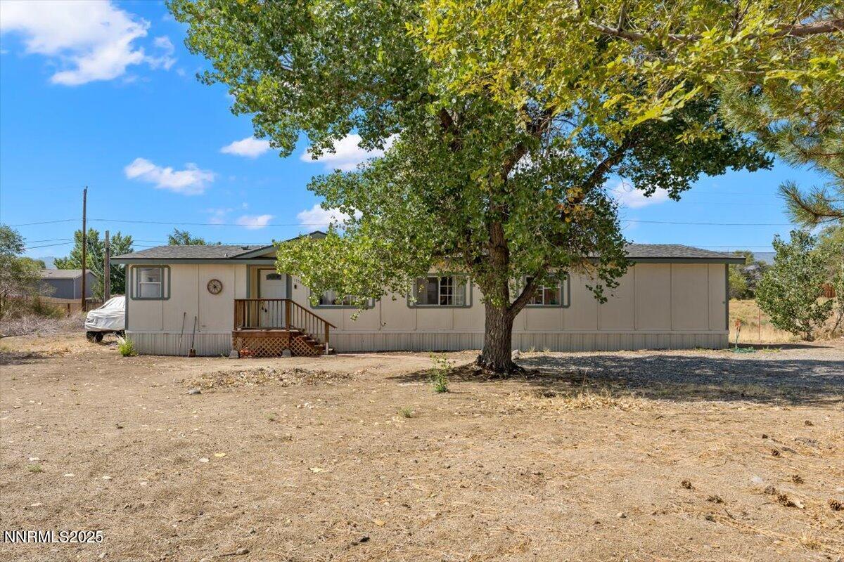17570 Thrush Lane Reno, NV 89508 - Photo 2 of 30 a view of a house with a tree in the background
