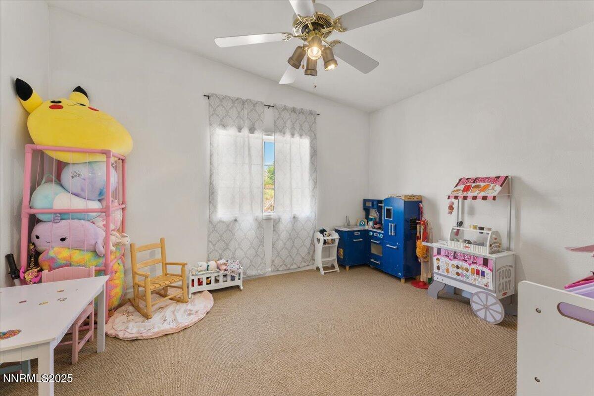17570 Thrush Lane Reno, NV 89508 - Photo 21 of 30 a kids room with toys and a chandelier