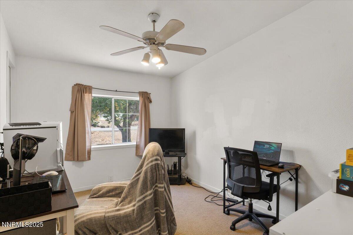 17570 Thrush Lane Reno, NV 89508 - Photo 25 of 30 a view of a workspace with furniture and a window