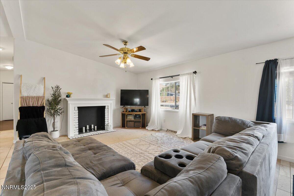 17570 Thrush Lane Reno, NV 89508 - Photo 9 of 30 a living room with furniture and a fireplace
