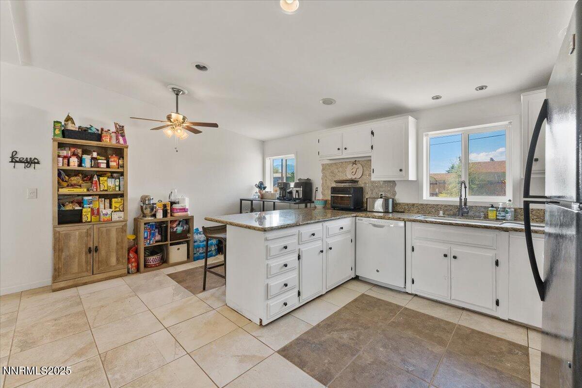 17570 Thrush Lane Reno, NV 89508 - Photo 10 of 30 a kitchen with cabinets and window