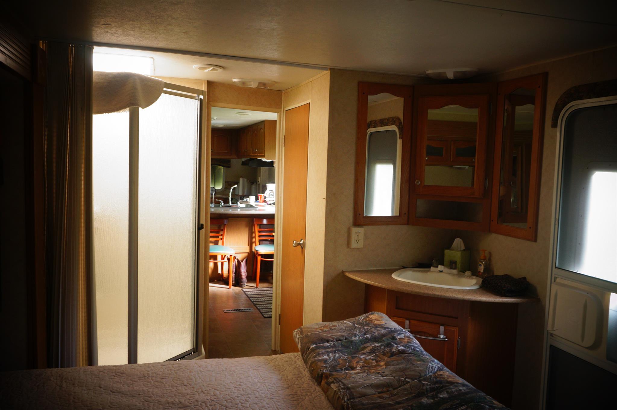 171 Poorhouse Road Taft, TN 38488 - Photo 15 of 27 a bedroom with a bed and a mirror