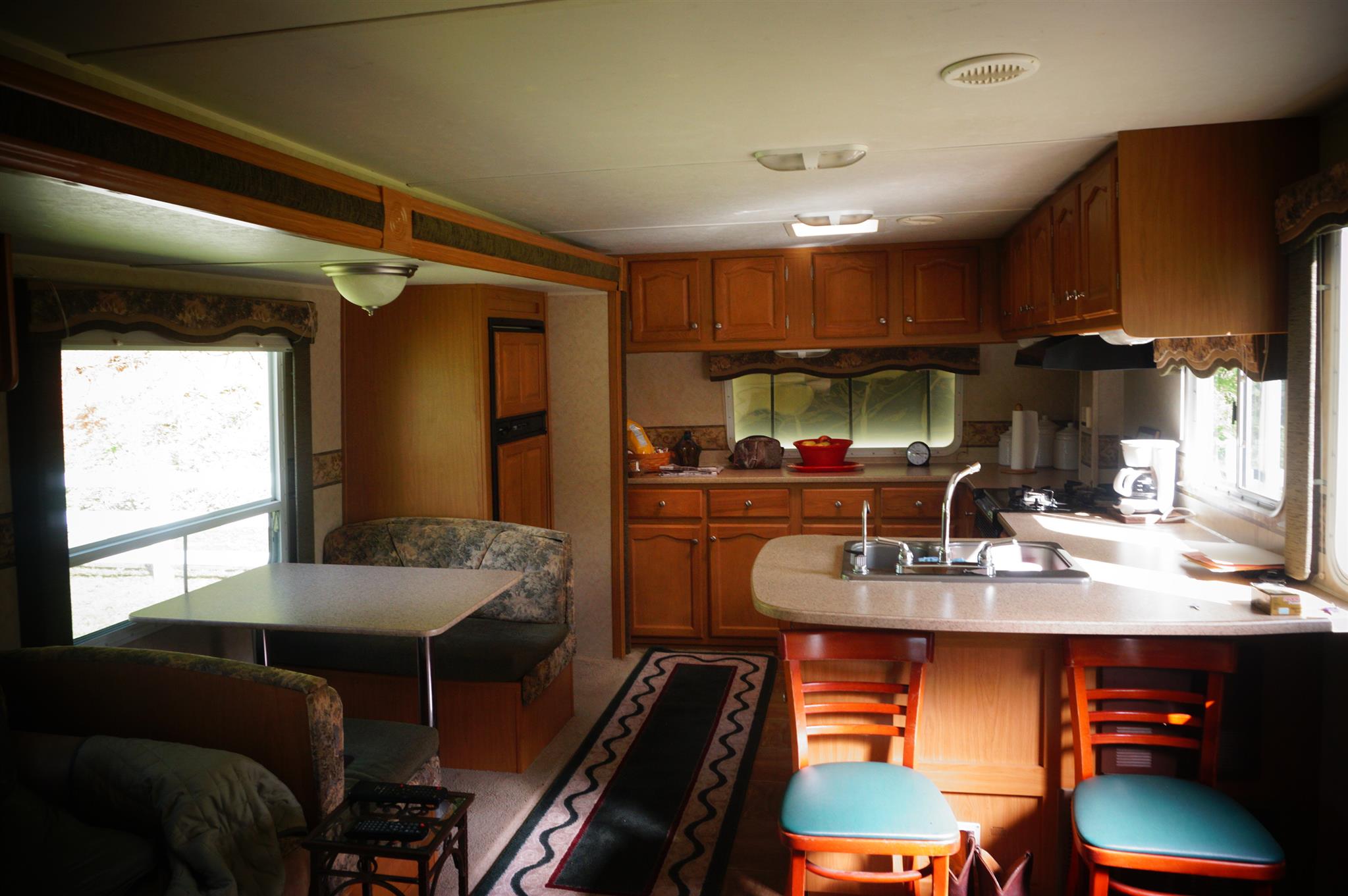 171 Poorhouse Road Taft, TN 38488 - Photo 16 of 27 a kitchen with a table chairs stove and cabinets