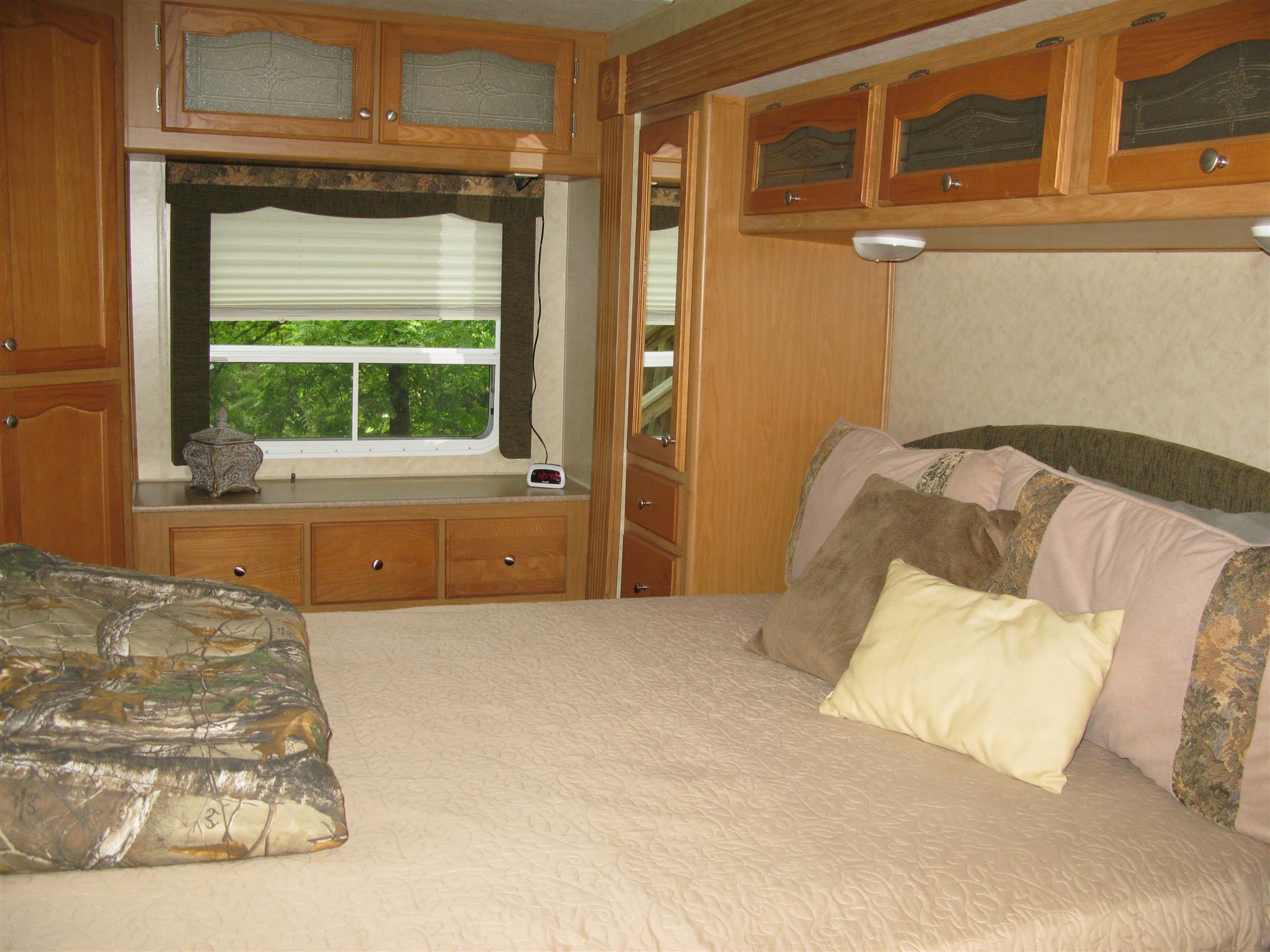 171 Poorhouse Road Taft, TN 38488 - Photo 17 of 27 a bedroom with a bed and a window