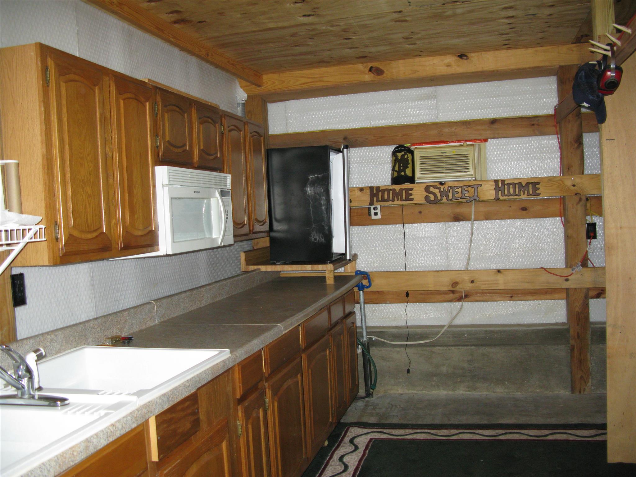 171 Poorhouse Road Taft, TN 38488 - Photo 26 of 27 a bathroom with a sink and a large mirror