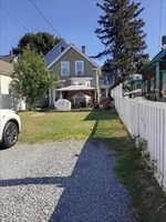 45 West Street Lowell, MA 01850 - Photo 2 of 3 a view of a house with pool yard and a chairs