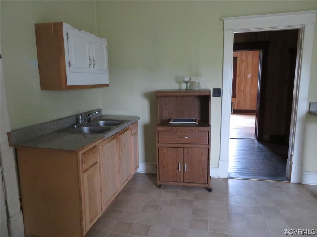 15417 Courthouse Road Dinwiddie, VA 23841 - Photo 31 of 40 a kitchen with a sink and cabinets