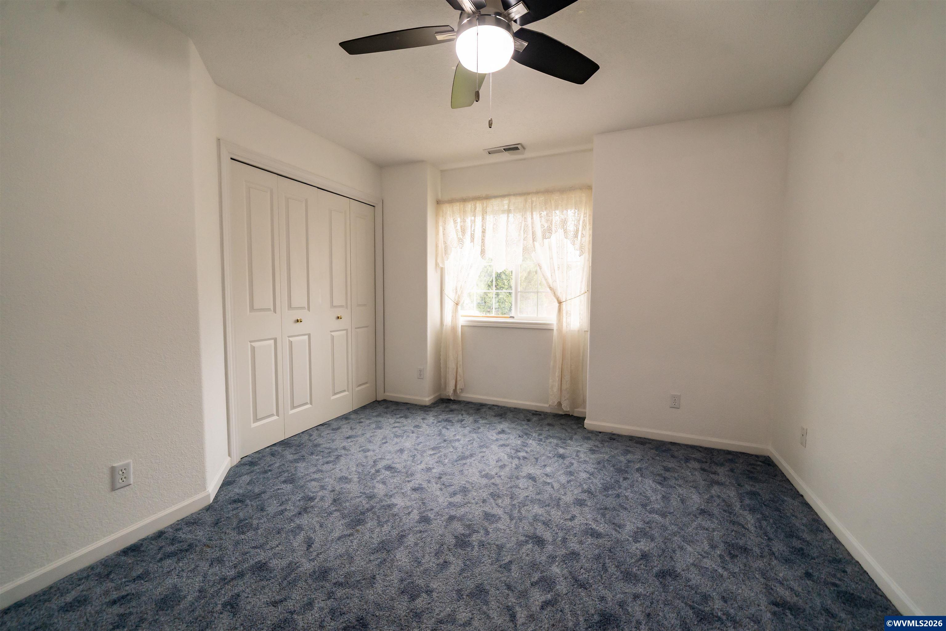 312 Southwest Cascade Meadow Drive Sublimity, OR 97385 - Photo 24 of 42 a view of an empty room with a window