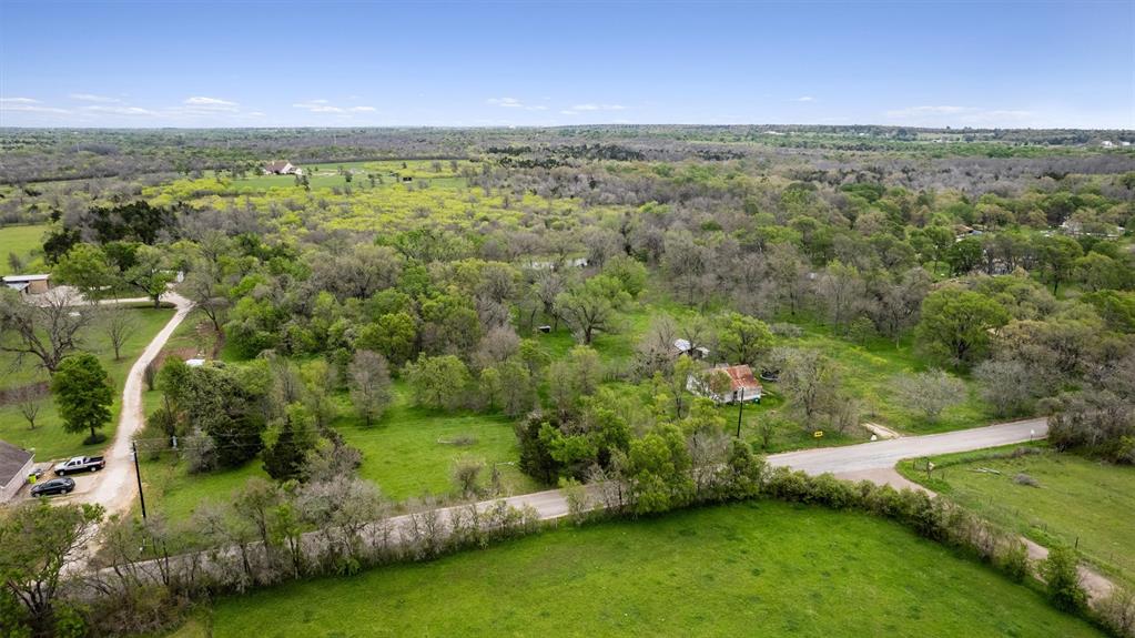 266 Beaver Road Elgin, TX 78621 - Photo 3 of 40 Vast, verdant landscape offering tranquil, private acreage with endless possibilities.