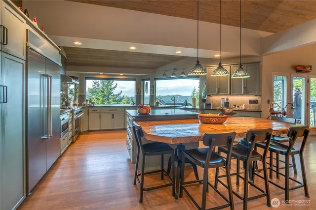 a dining room with furniture and wooden floor