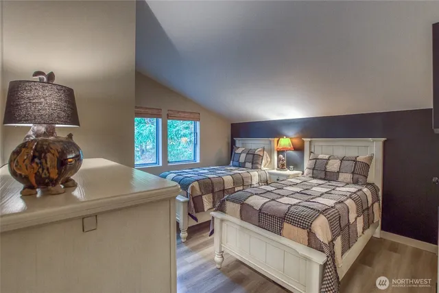 a kitchen with granite countertop a sink a stove and cabinets