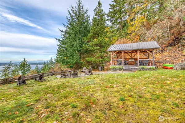 a kitchen with granite countertop a sink a stove and cabinets