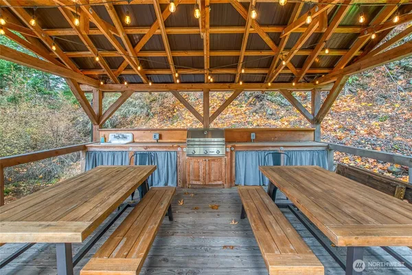 a bathroom with a toilet sink vanity and mirror