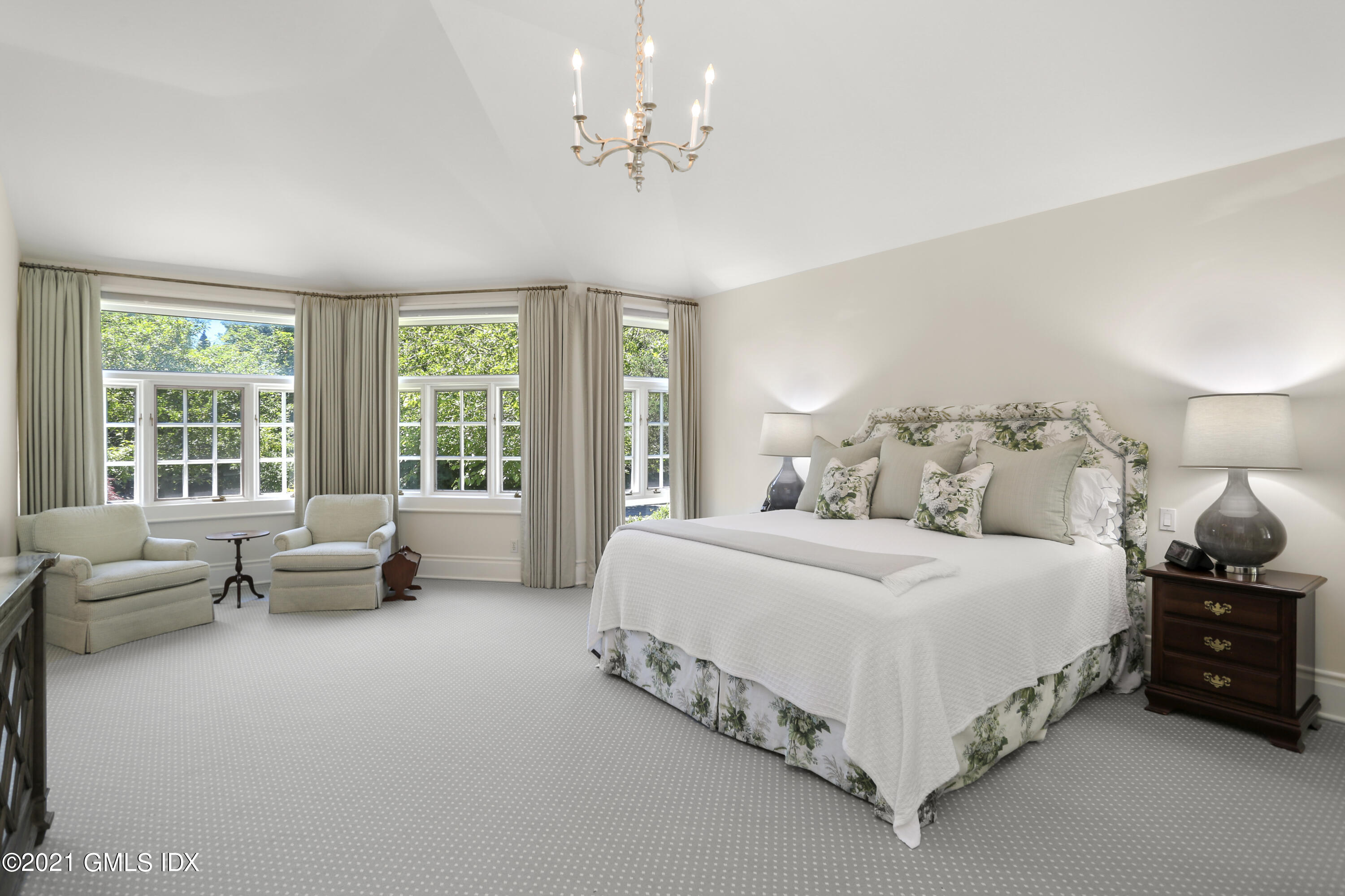 557 Round Hill Road Greenwich, CT 06831 - Photo 13 of 26 a spacious bedroom with a bed and large windows