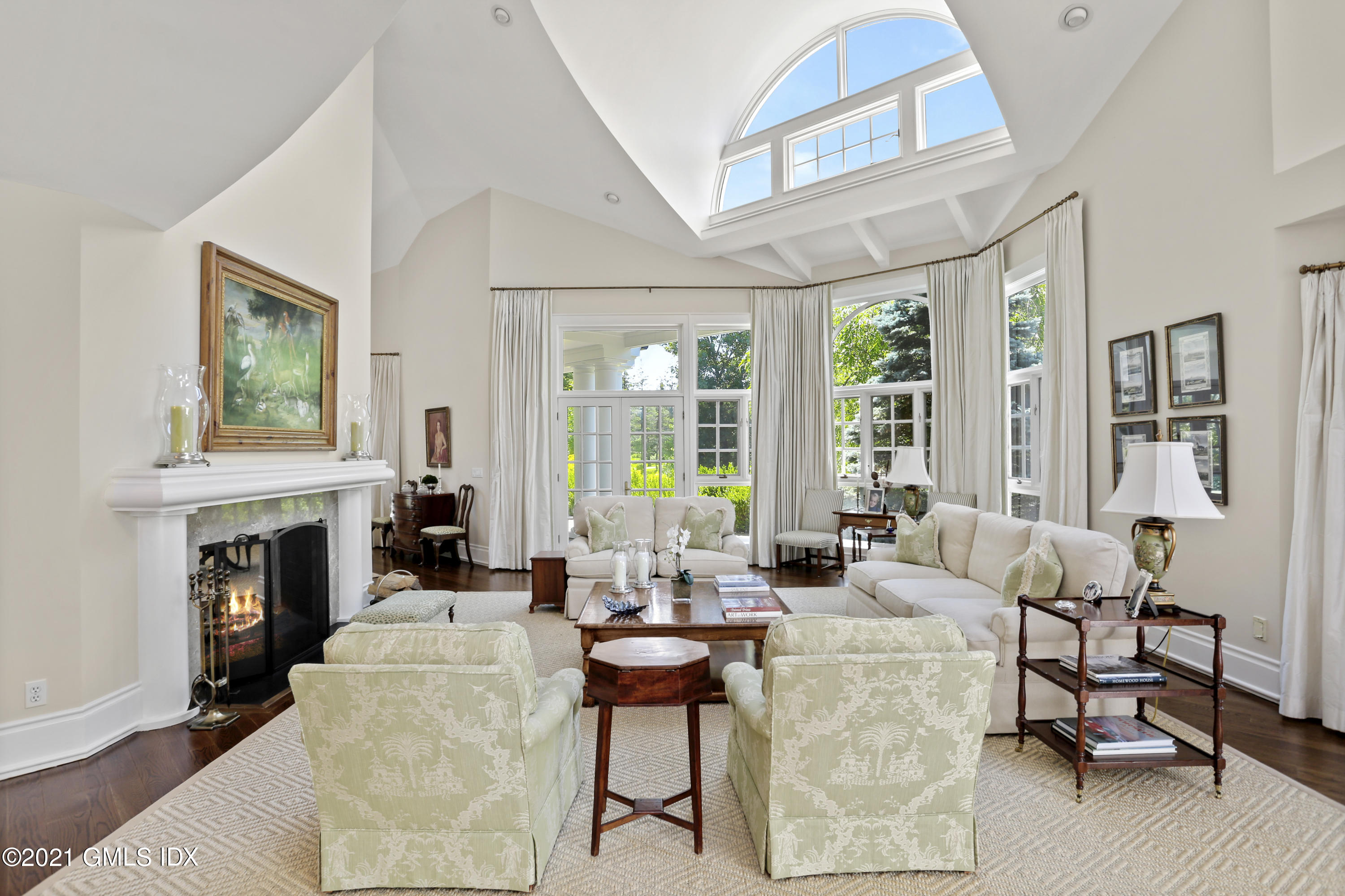 557 Round Hill Road Greenwich, CT 06831 - Photo 4 of 26 a living room with fireplace furniture and a large window