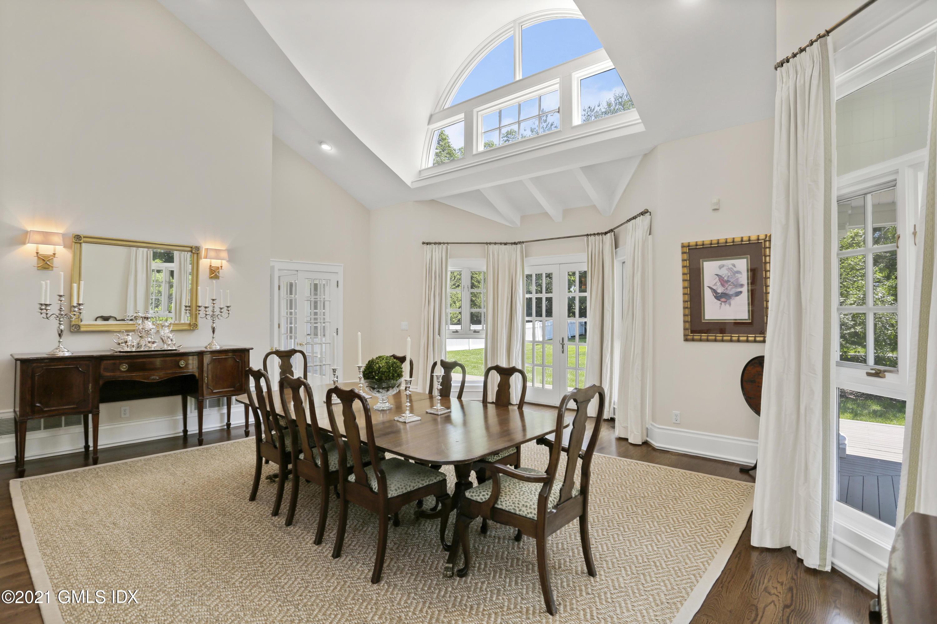 557 Round Hill Road Greenwich, CT 06831 - Photo 5 of 26 a view of a dining room with furniture window and wooden floor