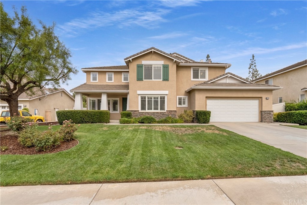 8328 Daisy Lane Riverside, CA 92508 - Photo 1 of 1 a front view of a house with a garden