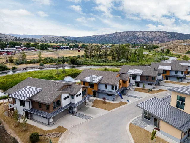 a view of a patio with swimming pool and a yard