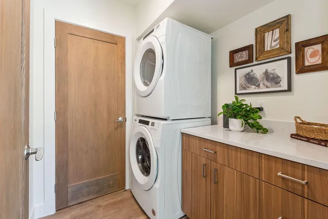 a kitchen with sink a stove and cabinets