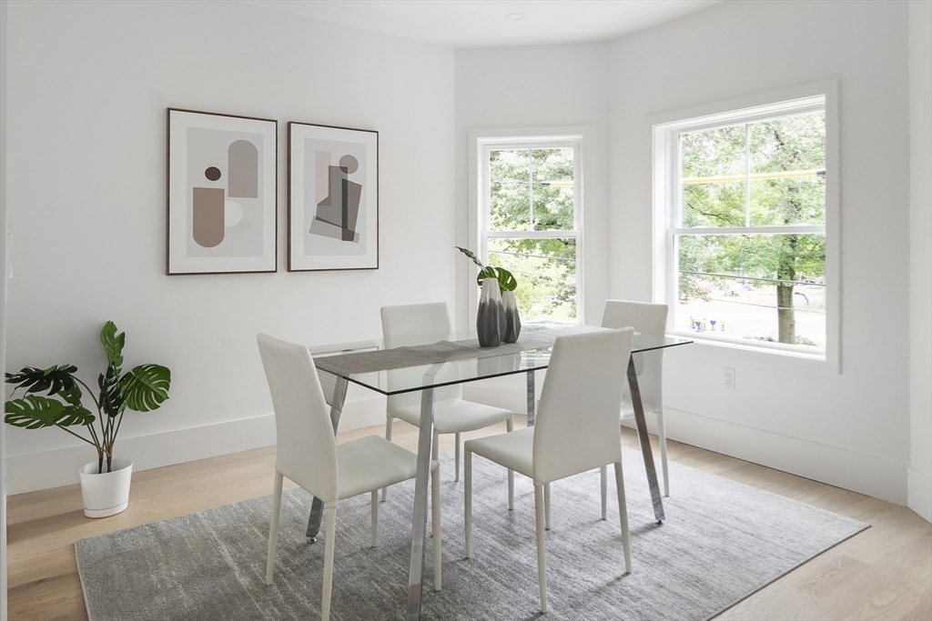 12-14 Edwin Street, Unit B Brookline, MA 02445 - Photo 7 of 18 a dining room with furniture and window