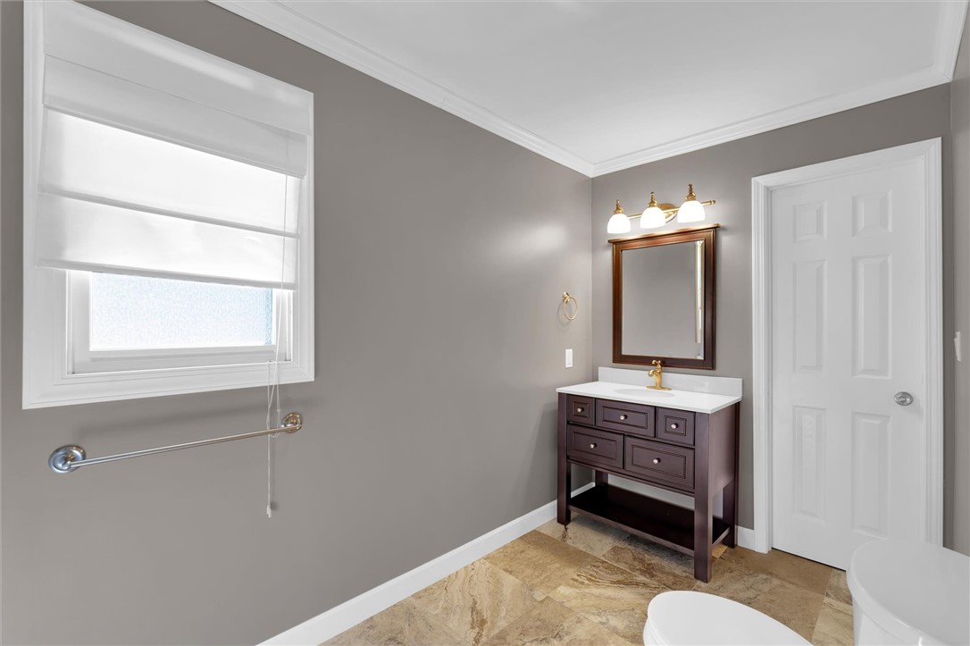 519 Hillandale Road Liberty, SC 29657 - Photo 16 of 24 Elegant crown molding complements the textured tile flooring in this refreshed bathroom.