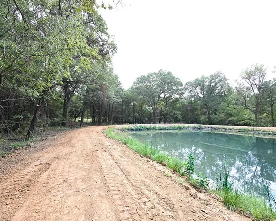 a view of a lake with a yard