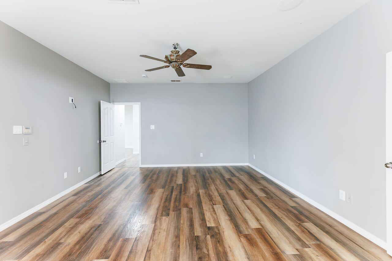 5811 11th Place, Unit 9 Lubbock, TX 79416 - Photo 35 of 50 a view of empty room with wooden floor