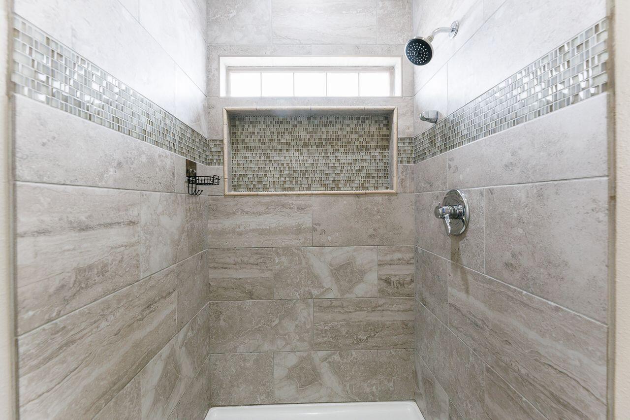 5811 11th Place, Unit 9 Lubbock, TX 79416 - Photo 41 of 50 a bathroom with a shower