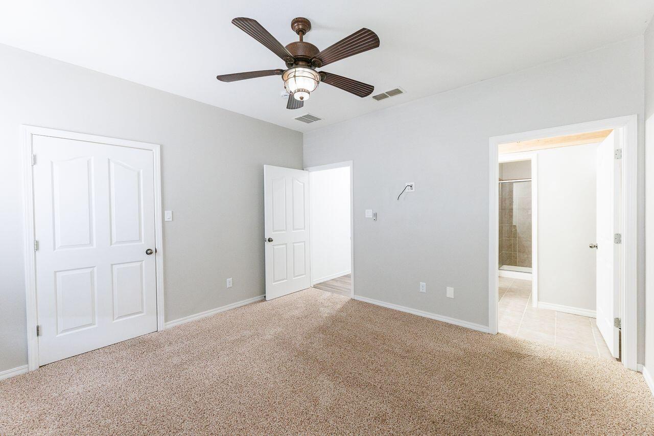 5811 11th Place, Unit 9 Lubbock, TX 79416 - Photo 43 of 50 wooden floor in an empty room
