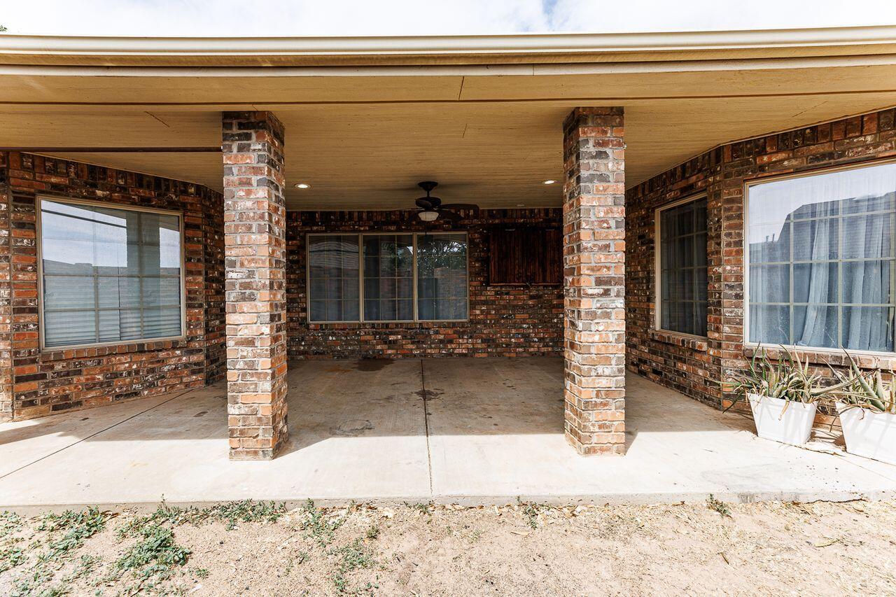 5811 11th Place, Unit 9 Lubbock, TX 79416 - Photo 49 of 50 a view of a house with a patio