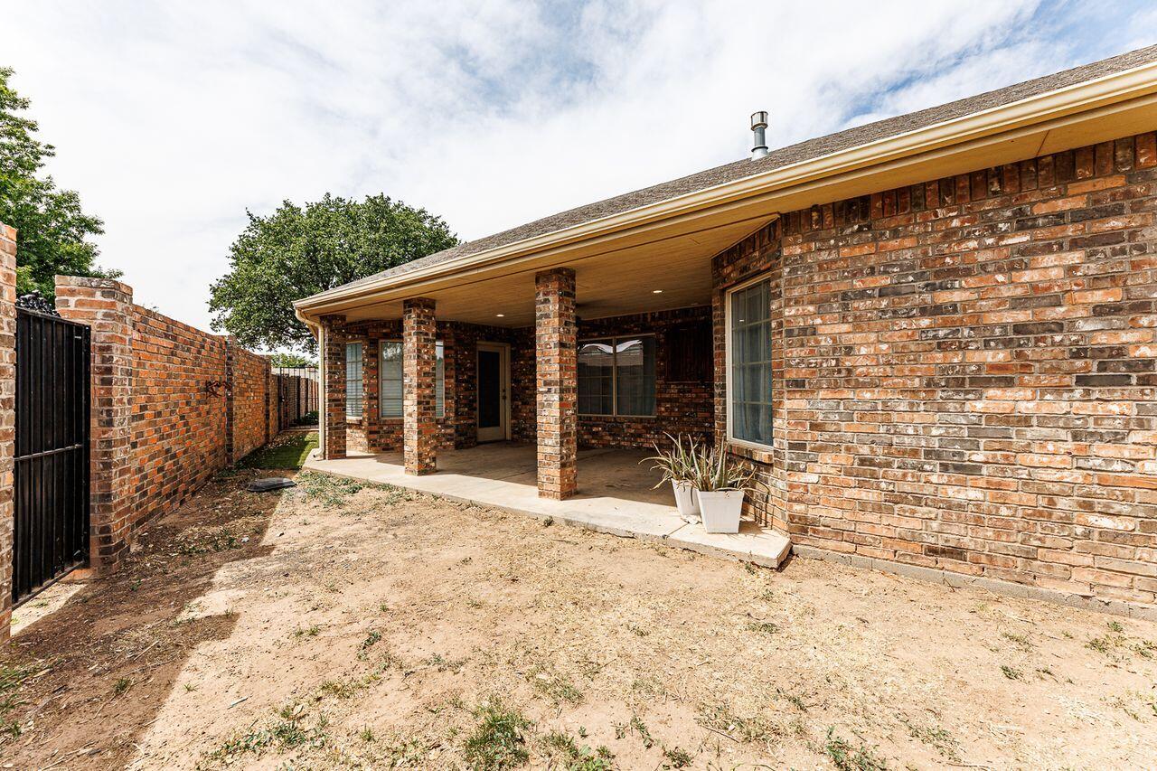 5811 11th Place, Unit 9 Lubbock, TX 79416 - Photo 50 of 50 a view of a house with backyard and sitting area