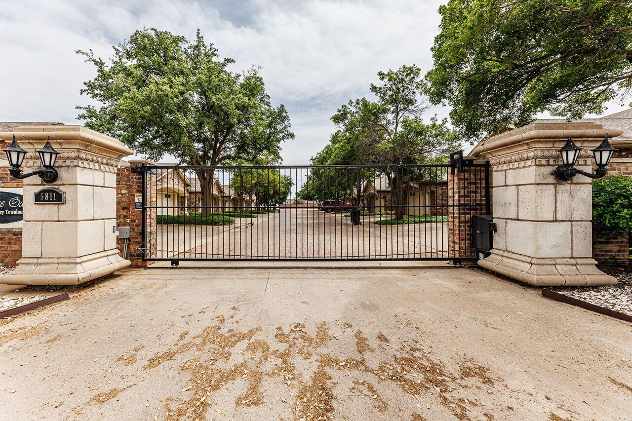 5811 11th Place, Unit 9 Lubbock, TX 79416 - Photo 5 of 50 a view of a fence
