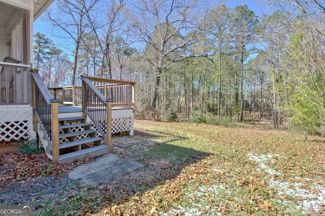 front view of a house with a large tree