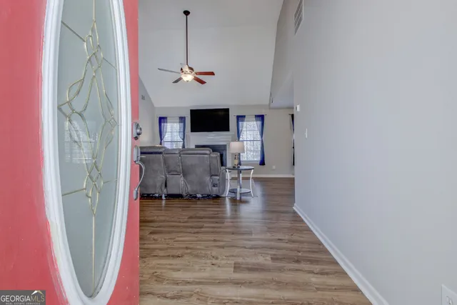 a view of living room with furniture and flat screen tv