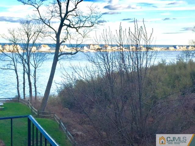 200 Portland Road, Unit 18B Highlands, NJ 07734 - Photo 13 of 18 a view of a yard with wooden fence