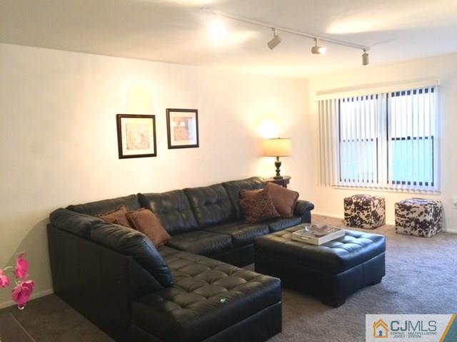 200 Portland Road, Unit 18B Highlands, NJ 07734 - Photo 14 of 18 a living room with furniture and a window