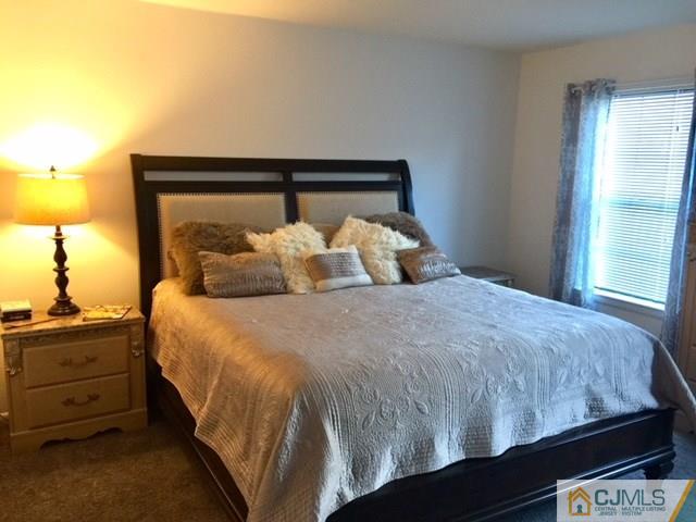 200 Portland Road, Unit 18B Highlands, NJ 07734 - Photo 3 of 18 a bedroom with a bed and window