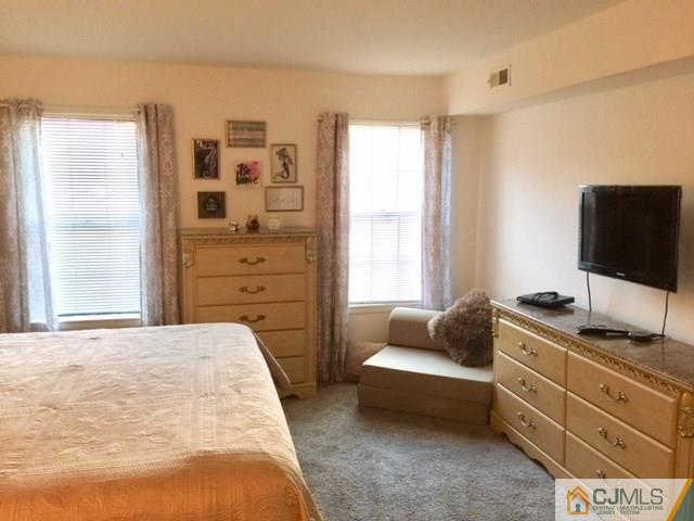200 Portland Road, Unit 18B Highlands, NJ 07734 - Photo 4 of 18 a bedroom with a bed and furniture
