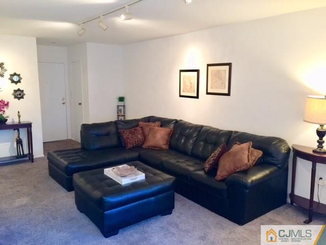 200 Portland Road, Unit 18B Highlands, NJ 07734 - Photo 6 of 18 a living room with furniture and a couch