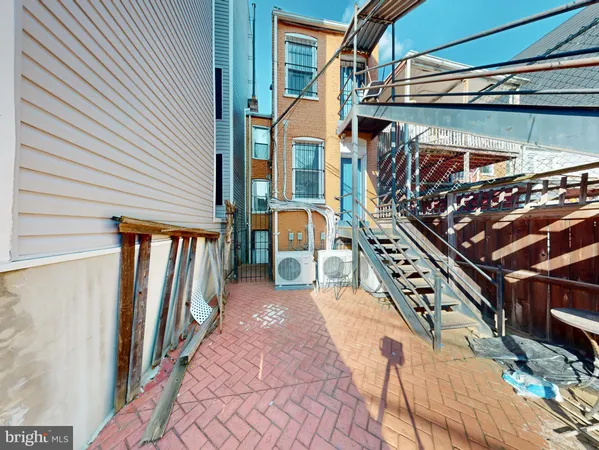 a view of a house with a small yard