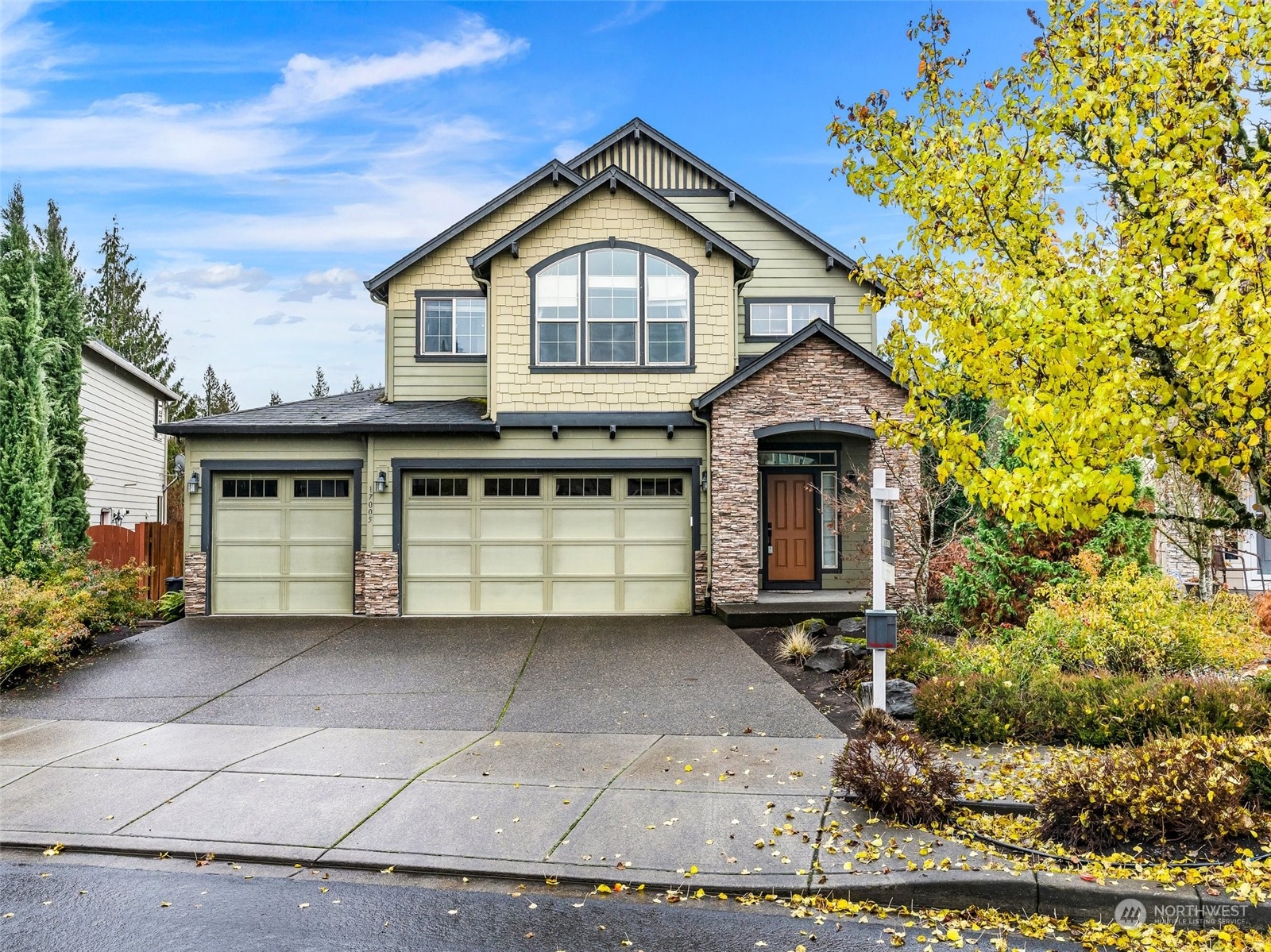 17005 Northeast 33rd Avenue Ridgefield, WA 98642 - Photo 1 of 38 a front view of a house with a yard and garage