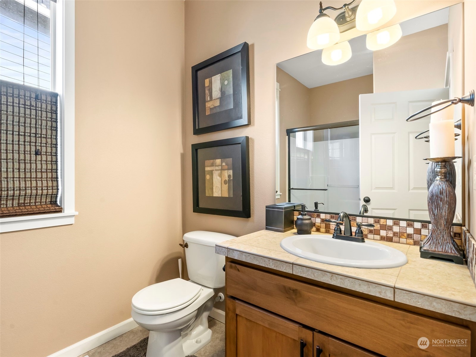 17005 Northeast 33rd Avenue Ridgefield, WA 98642 - Photo 11 of 38 a bathroom with a granite countertop toilet sink and mirror